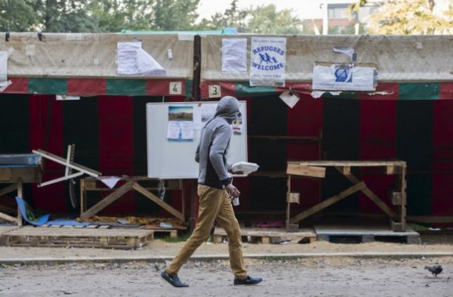 a migrant walks inside a makeshift camp outside a foreign office where migrants register in brussels belgium october 1 2015 photo reuters a migrant walks inside a makeshift camp outside a foreign office where migrants register in brussels belgium october 1 2015 photo reuters