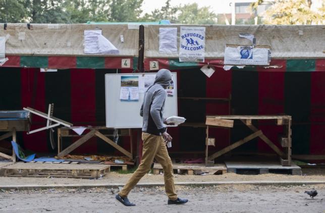 a migrant walks inside a makeshift camp outside a foreign office where migrants register in brussels belgium october 1 2015 photo reuters