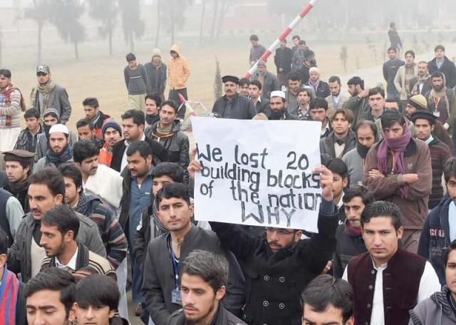 students stage a demonstration outside the bacha khan university photo afp students stage a demonstration outside the bacha khan university photo afp