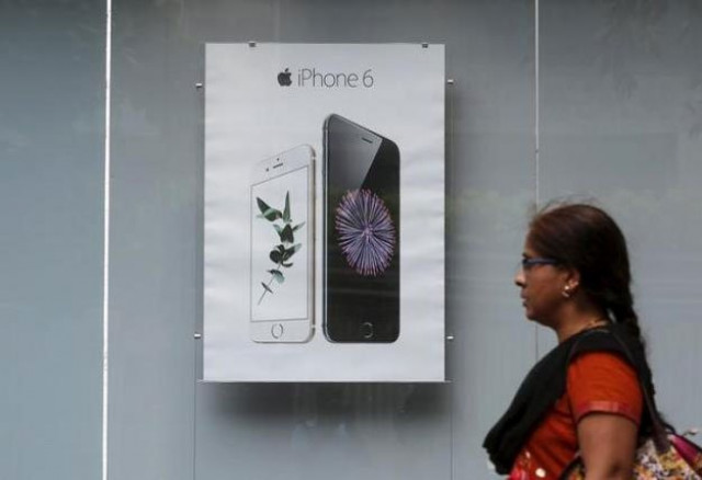 a pedestrian walks past an apple iphone 6 advertisement at an electronics store in mumbai india july 24 2015 photo reuters a pedestrian walks past an apple iphone 6 advertisement at an electronics store in mumbai india july 24 2015 photo reuters