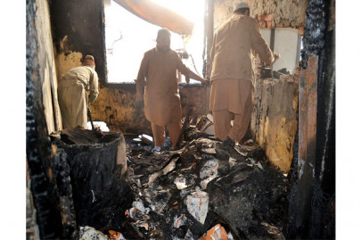 gutted blaze engulfs plaza in city