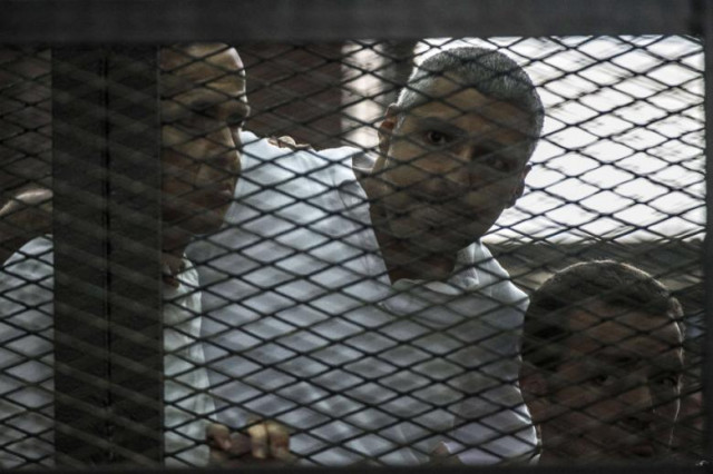 al jazeera news channel 039 s australian journalist peter greste l and his colleagues egyptian canadian mohamed fadel fahmy c and egyptian baher mohammed listen to the verdict inside the defendants cage during their trial for allegedly supporting the muslim brotherhood on june 23 2014 at the police institute near cairo 039 s tora prison photo afp al jazeera news channel 039 s australian journalist peter greste l and his colleagues egyptian canadian mohamed fadel fahmy c and egyptian baher mohammed listen to the verdict inside the defendants cage during their trial for allegedly supporting the muslim brotherhood on june 23 2014 at the police institute near cairo 039 s tora prison photo afp