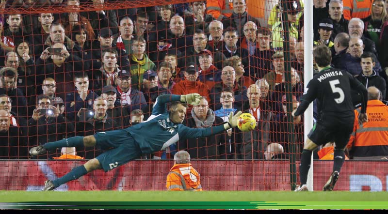 mignolet fresh from signing a five year contract extension proved his worth as he saved two penalties to allow allen to net the decisive spot kick and take liverpool to the final photo reuters