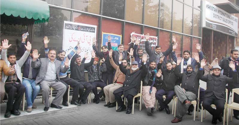 pia workers in lahore held a demonstration in front of the pia head office on wednesday photo express