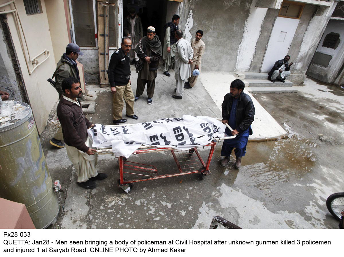 men carry body of a policeman killed in quetta on january 28 2015 photo online