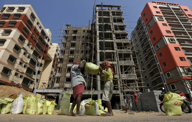 labourers work at the construction site of a residential complex on the outskirts of kolkata india in this january 23 2016 file photo photo reuters