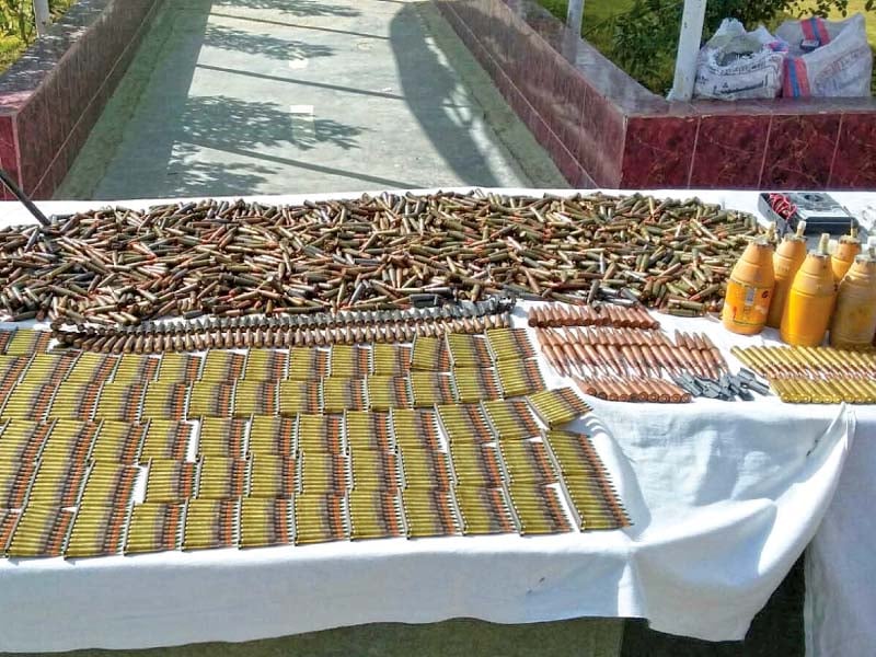 fc officials display a huge cache of confiscated arms photo express