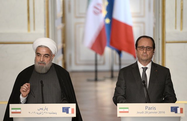 french president francois hollande and iranian president hassan rouhani l give a joint press conference on january 28 2016 at the elysee presidential palace in paris photo afp