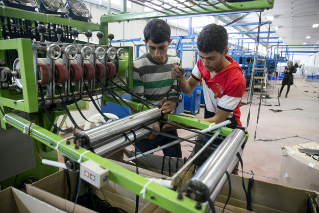 palestinians work at a textile factory in the industrial park of the west bank jewish settlement of barkan southwest of nablus november 8 2015 photo reuters