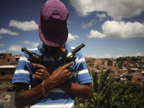 a brazilian drug gang member nicknamed poison 18 overlooking a slum in salvador which had 57 51 homicides per 100 000 residents in 2013 photo reuters