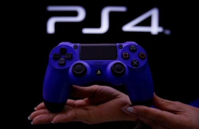 a staff at the playstation 4 launch event poses with the playstation 4 039 s game controller before its domestic launch event at the sony showroom in tokyo february 21 2014 photo reuters a staff at the playstation 4 launch event poses with the playstation 4 039 s game controller before its domestic launch event at the sony showroom in tokyo february 21 2014 photo reuters