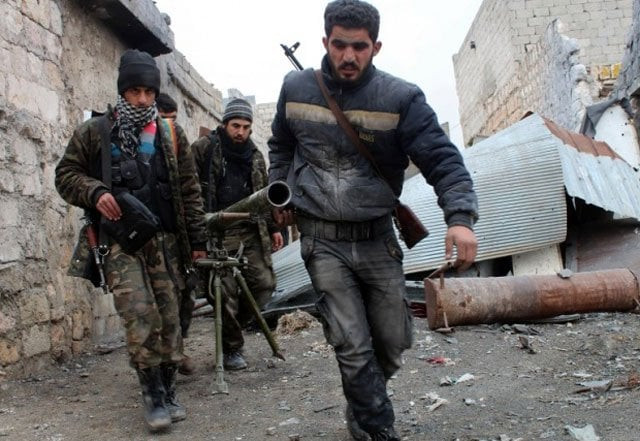 opposition rebels recover their wounded after fighting against government forces in syria in may photo afp opposition rebels recover their wounded after fighting against government forces in syria in may photo afp