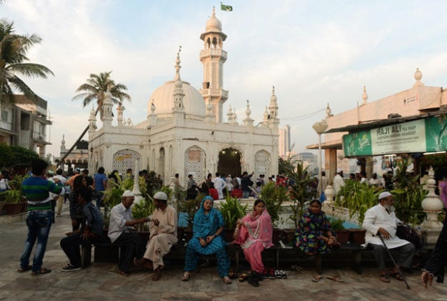 in this photograph taken on december 9 2015 indian muslims and visitors are seen inside the haji ali dargah in mumbai photo afp in this photograph taken on december 9 2015 indian muslims and visitors are seen inside the haji ali dargah in mumbai photo afp