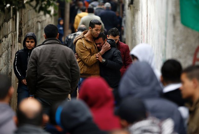 palestinians mourn the death of seven hamas militants who were killed after a tunnel built for fighting israel collapsed in the gaza strip during their funeral procession in gaza city on january 29 2016 photo afp