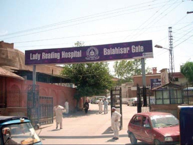 lady reading hospital photo express