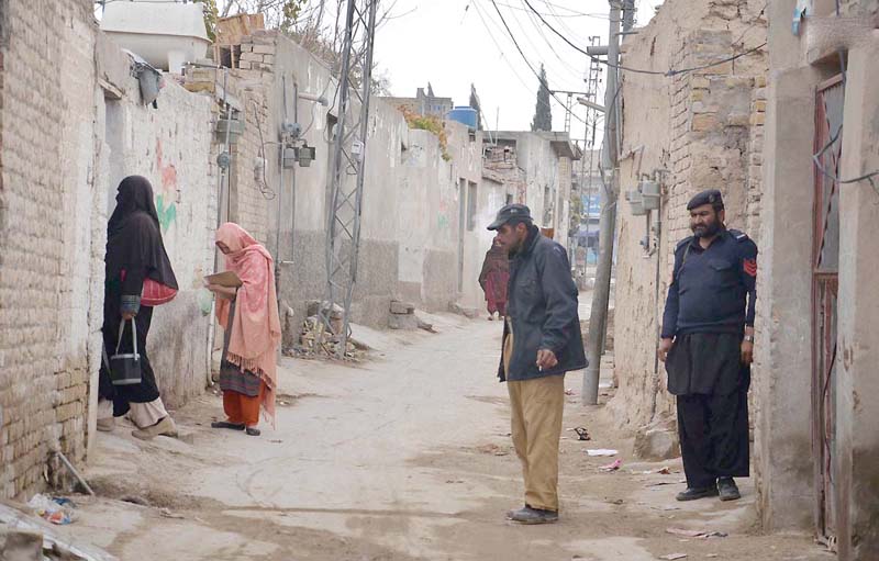 policemen guarding polio vaccinators photo nni