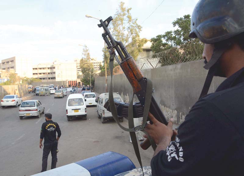 police commandoes stand at guard outside schools in saddar karachi law enforcers have asked universities in jamshoro and hyderabad to step up security in light of the prevailing threats of terrorist attacks on educational institutions photo rashid ajmeri express