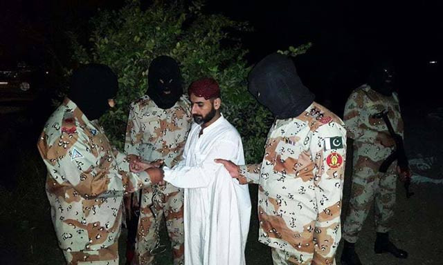photo released by rangers shows uzair baloch being handcuffed by the paramilitary force photo pakistan rangers photo released by rangers shows uzair baloch being handcuffed by the paramilitary force photo pakistan rangers