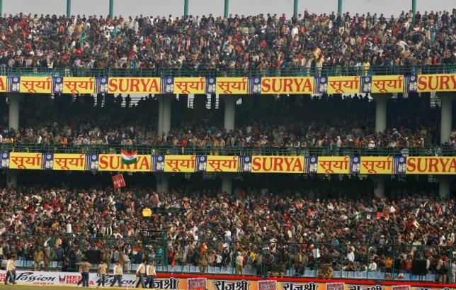 spectators wait in stands after fifth one day international cricket match between india and sri lanka was abandoned in new delhi in 2009 photo reuters