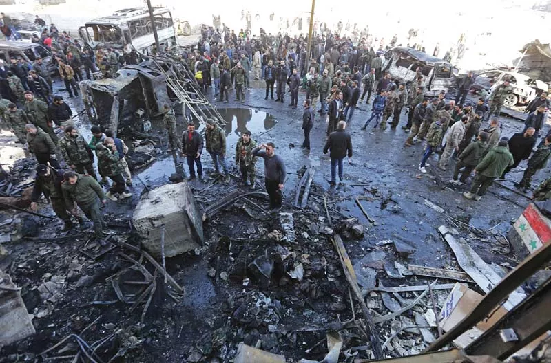 people gather at the site of multiple bombings near the shrine of bibi zainab ra in damascus photo afp people gather at the site of multiple bombings near the shrine of bibi zainab ra in damascus photo afp