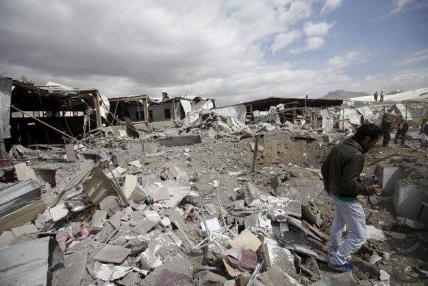 a man walks through the debris outside a tea factory after it was hit by saudi led air strikes in yemen 039 s capital sanaa january 30 2016 reuters