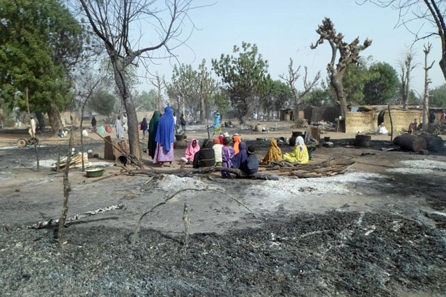 women and children sit among burnt houses after boko haram attacks at dalori village on the outskirts of maiduguri in northeastern nigeria on january 31 2016 around 50 people were killed when boko haram fighters armed with guns and explosives attacked a village in northeastern nigeria medics and local residents said on on january 31 nigeria 039 s army said the gunmen attacked dalori just outside the northern city of maiduguri late on january 30 burning down the village and sending residents fleeing into the bush photo afp women and children sit among burnt houses after boko haram attacks at dalori village on the outskirts of maiduguri in northeastern nigeria on january 31 2016 around 50 people were killed when boko haram fighters armed with guns and explosives attacked a village in northeastern nigeria medics and local residents said on on january 31 nigeria 039 s army said the gunmen attacked dalori just outside the northern city of maiduguri late on january 30 burning down the village and sending residents fleeing into the bush photo afp