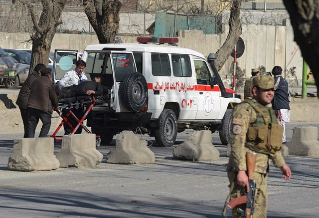 afghan security personnel carry a victim to an ambulance at the site of a suicide car bomb next to a police base in kabul on february 1 2016 photo afp afghan security personnel carry a victim to an ambulance at the site of a suicide car bomb next to a police base in kabul on february 1 2016 photo afp
