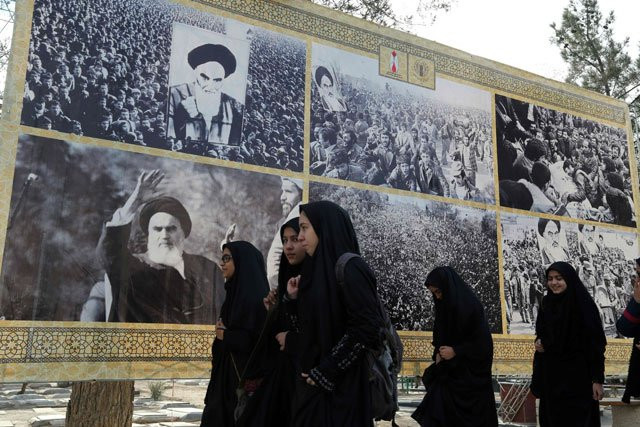 iranian schoolgirls walk past a giant board displaying pictures of the late founder of the islamic revolution ayatollah ruhollah khomeini as iranians mark the start of 10 days of celebrations for the 37th anniversary of the islamic revolution on february 1 2016 at the behesht e zahra zahra 039 s paradise cemetery in southern tehran photo afp iranian schoolgirls walk past a giant board displaying pictures of the late founder of the islamic revolution ayatollah ruhollah khomeini as iranians mark the start of 10 days of celebrations for the 37th anniversary of the islamic revolution on february 1 2016 at the behesht e zahra zahra 039 s paradise cemetery in southern tehran photo afp
