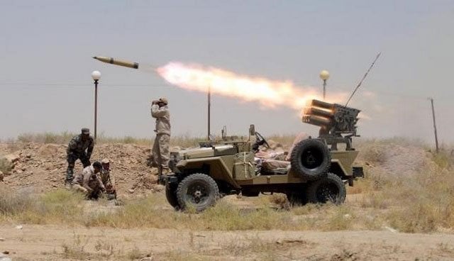 members of iraq 039 s shia paramilitaries launch a rocket towards islamic state militants in the outskirts of the city of falluja in the province of anbar iraq july 12 2015 photo reuters