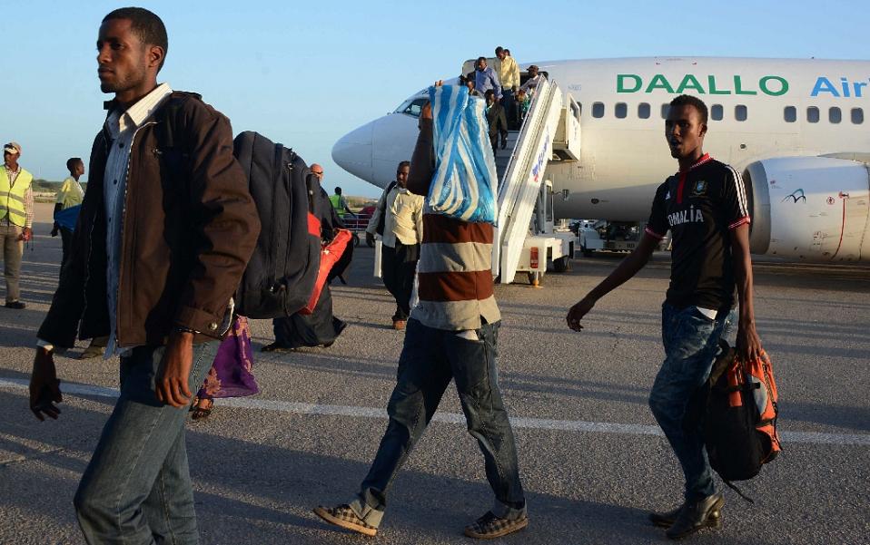 passengers disembark from a daalo airlines plane at mogadishu airport photo afp