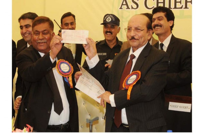 cm sindh giving away a cheque of rs 10 million to kba president photo ppi cm sindh giving away a cheque of rs 10 million to kba president photo ppi