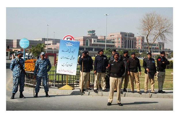 personnel of punjab police and airport security force standing alert to stop pia employees during their rally to show solidarity with their colleagues in karachi photo online