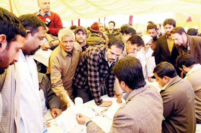people submit their claims for compensation on wednesday at the one window land acquisition camp set up near the uet photo abid nawaz express people submit their claims for compensation on wednesday at the one window land acquisition camp set up near the uet photo abid nawaz express