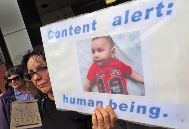 people protest outside an immigration office in sydney on february 4 2016 as australian church leaders say they will offer sanctuary to asylum seekers set to be deported to a remote pacific camp photo afp