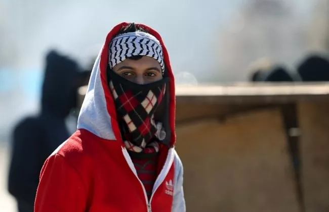 a palestinian protester is seen during clashes with israeli troops in the west bank village of qabatya near jenin february 4 2016 photo reuters a palestinian protester is seen during clashes with israeli troops in the west bank village of qabatya near jenin february 4 2016 photo reuters