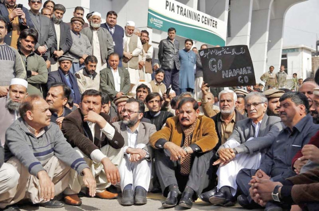 cm pervez khattak sits with pia employees to protest use of police force on demonstrators photo ppi cm pervez khattak sits with pia employees to protest use of police force on demonstrators photo ppi