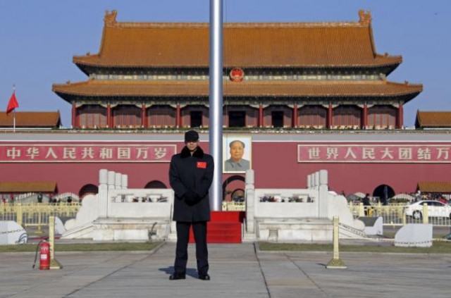 a security guard keeps watch at tiananmen square in beijing december 10 2015 photo reuters a security guard keeps watch at tiananmen square in beijing december 10 2015 photo reuters