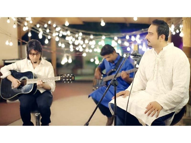 guitar virtuoso faraz anwar and bassist mubbashir are perched up on stools with khan playing in sync with the track photo publicity guitar virtuoso faraz anwar and bassist mubbashir are perched up on stools with khan playing in sync with the track photo publicity