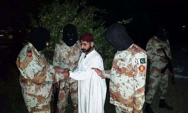 a file photo shows uzair baloch being handcuffed by the paramilitary force photo pakistan rangers