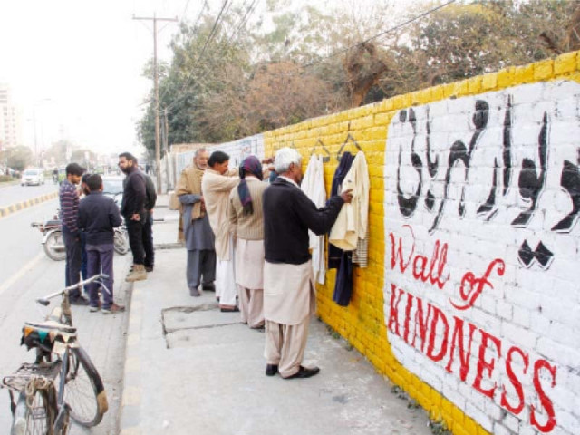 visitors go through clothes displayed at the wall photo abid nawaz express visitors go through clothes displayed at the wall photo abid nawaz express