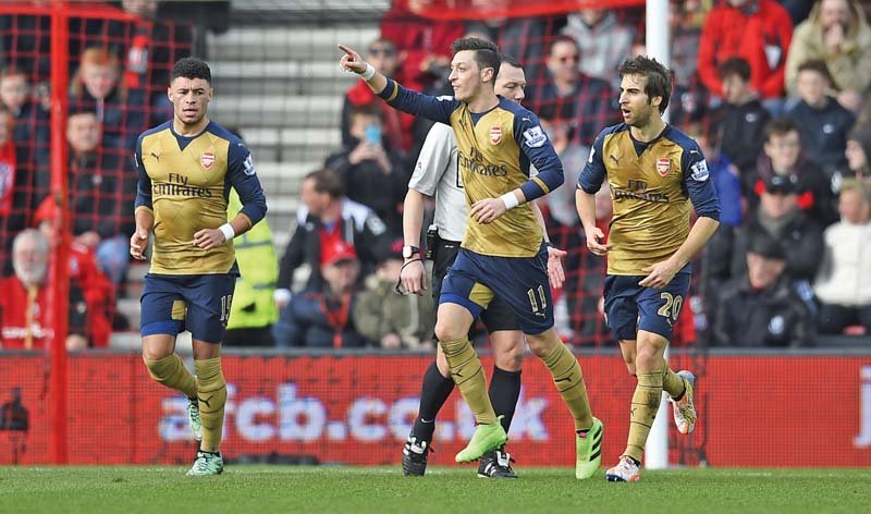two goals in a minute by ozil and chamberlain were enough to secure three points for arsenal and take them to third in the table photo afp