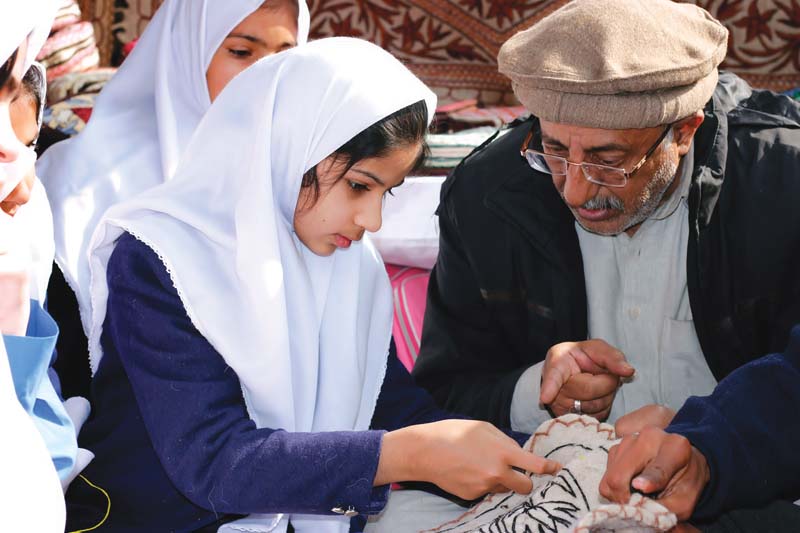 artisans teach students kashmiri crafts during the programme at lok virsa photo muhammad javaid express