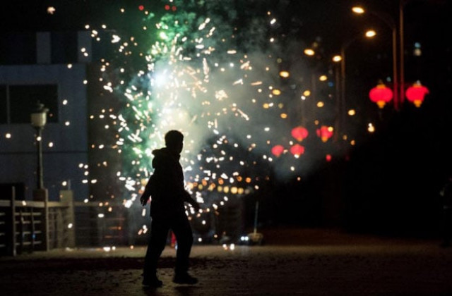 a man sets off fireworks to celebrate the lunar new year of the monkey photo afp a man sets off fireworks to celebrate the lunar new year of the monkey photo afp