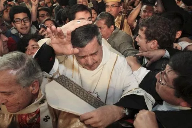 bishop juan barros c attends his first religious service as citizens back r protest against him at the osorno cathedral south of santiago march 21 2015 photo reuters bishop juan barros c attends his first religious service as citizens back r protest against him at the osorno cathedral south of santiago march 21 2015 photo reuters