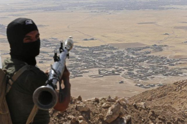 a kurdish peshmerga fighter holds a a rocket propelled grenade launcher as he takes up position in an area overlooking baretle village background which is controlled by the islamic state in khazir on the edge of mosul september 8 2014 photo reuters a kurdish peshmerga fighter holds a a rocket propelled grenade launcher as he takes up position in an area overlooking baretle village background which is controlled by the islamic state in khazir on the edge of mosul september 8 2014 photo reuters
