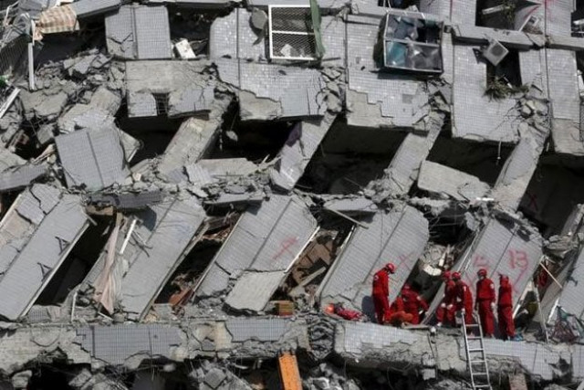 rescue personnel work at the site where a 17 storey apartment building collapsed after an earthquake hit tainan southern taiwan february 7 2016 reuters rescue personnel work at the site where a 17 storey apartment building collapsed after an earthquake hit tainan southern taiwan february 7 2016 reuters