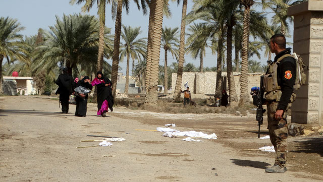 a member from iraqi security forces stands guard while civilians flee to a safe area in ramadi city february 7 2016 photo reuters