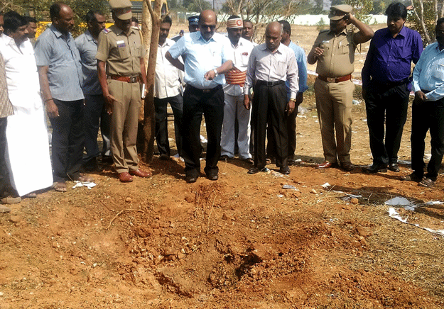 indian authorities inspect the site of a suspected meteorite landing on february 7 2016 in vellore district in southern tamil nadu photo afp