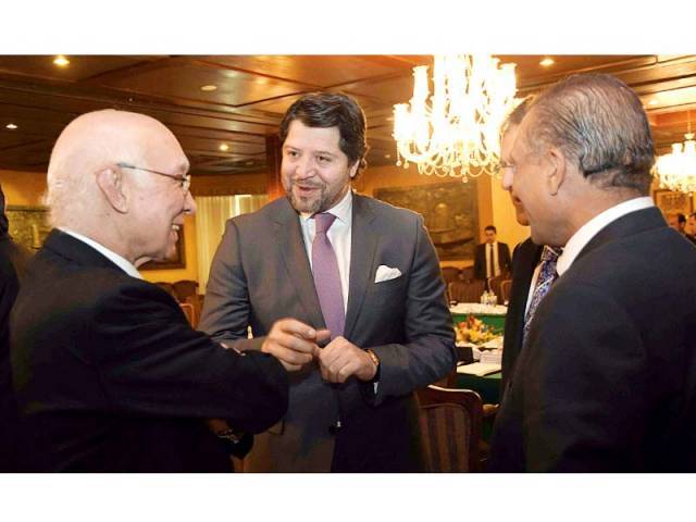 national security adviser sartaj aziz speaks to afghan deputy foreign minister hekmat khalil karzai prior to the start of the third round of four way peace talks in islamabad photo app