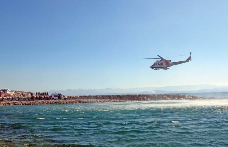 ambulance personnel ferry migrants rescued at sea by a helicopter to a waiting ambulance in balikesir photo afp